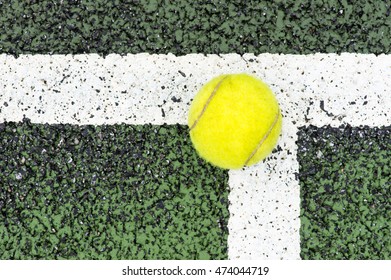 Tennis ball touches the corner line. Concept image for "IN" or score.