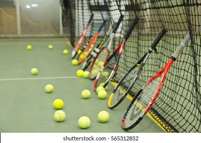Tennis balls, rackets and net