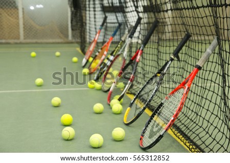 Tennis balls, rackets and net
