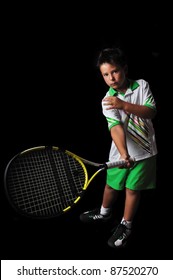 Tennis Boy Playing Forehand Isolated In Black