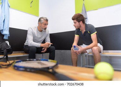 Tennis Coach Talking To Player In Changing Room