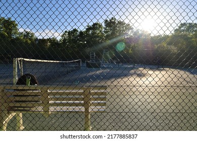 Tennis Court Bench And Sunlight