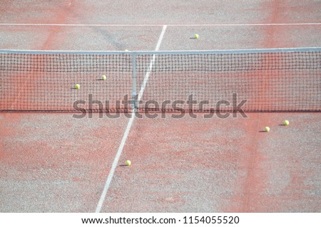 Similar – Leerer Tennisplatz mit Ballwagen und leuchtend rotem Belag