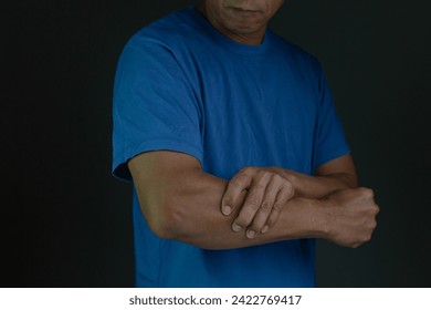 Tennis elbow, pain and injury with a sports man holding his joint during training, workout and exercise. Fitness, health and accident with a female athlete in a game or match on a court outside - Powered by Shutterstock