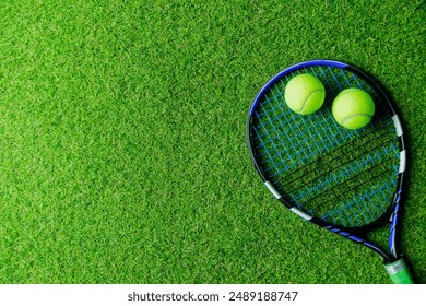 Tennis equipment placed on green grass. Overhead view with space for text. Ideal for promotional banners or advertisements. - Powered by Shutterstock