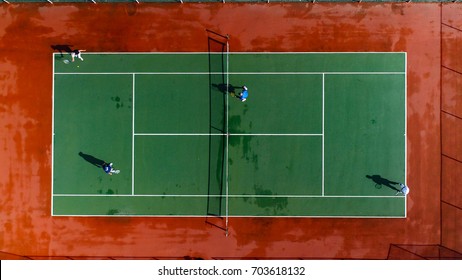 Tennis match, doubles, drone view. - Shutterstock ID 703618132