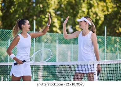 Tennis match winner and fit female athlete high five hands to success, celebrating after game on outdoor sports court. Women training exercise for wellness, healthy fitness lifestyle and summer fun. - Powered by Shutterstock