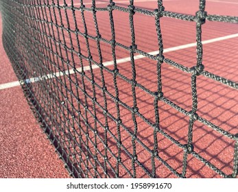 Tennis Net Close Up With Shadows On Hard Background