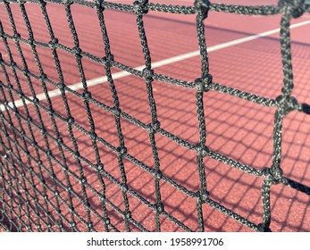 Tennis Net Close Up With Shadows On Hard Background