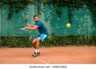 Tennis player about to hit the ball back. Man showing perfect footwork, agility and defensive techniques. - Powered by Shutterstock