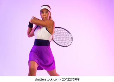 Tennis player. Beautiful girl teenager and athlete with racket in pink sporswear and hat on tennis court. Fashion and sport concept. - Powered by Shutterstock