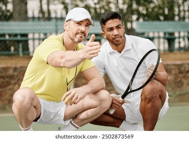 Tennis player, coach and talking to man on court with game strategy, playing instructions or match planning. Sport, mentor and athlete with pointing for tournament formation, explaining or discussion - Powered by Shutterstock