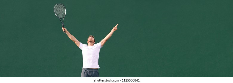 Tennis player man winning cheering celebrating victory in match point. Winner male athlete happy with arms up to the sky in celebration of success and win. Panoramic banner.