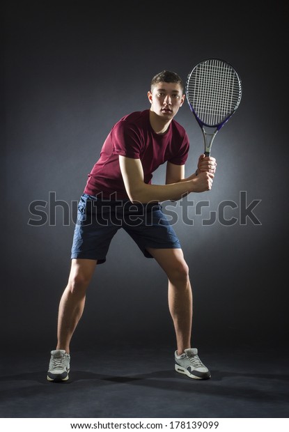  tennis player\
prepared for backhand stroke