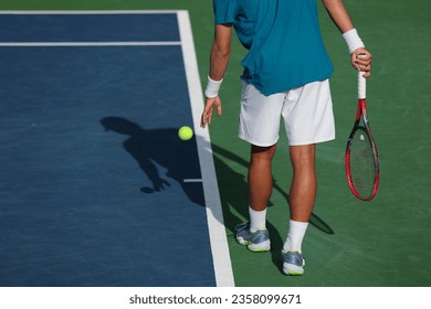 tennis player preparing to serve - Powered by Shutterstock