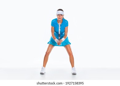 Tennis player with racket in blue costume. Woman athlete playing isolated on white background.