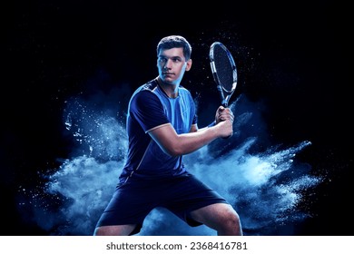 Tennis player with racket closeup. Man athlete playing isolated on black background. - Powered by Shutterstock