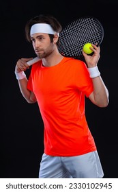 Tennis player with racket. Man athlete playing isolated on black background.