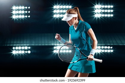 Tennis player with racket. Woman athlete celebrating victory on grand arena background after good play. - Powered by Shutterstock