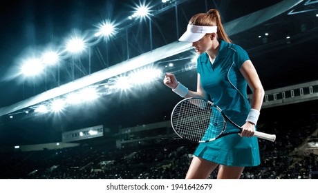 Tennis player with racket. Woman athlete celebrating victory on grand arena background after good play. - Powered by Shutterstock