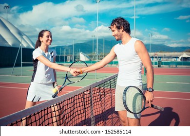 Tennis Players Giving Handshake - Powered by Shutterstock