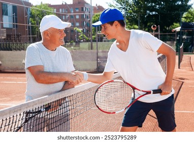 Tennis players shake hands before tennis match - Powered by Shutterstock