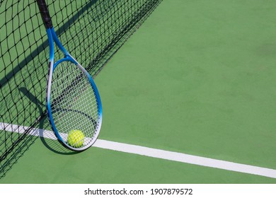 Tennis Racket And Tennis Ball On Court.