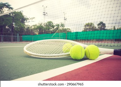 tennis racket and balls on the tennis court vintage color - Powered by Shutterstock