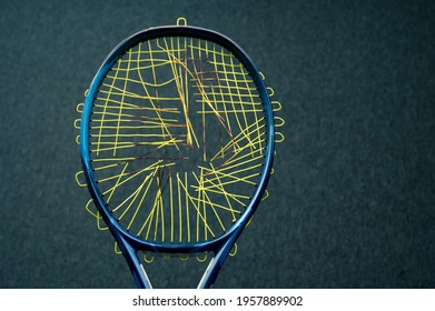 Tennis Racket With Cutting Ctrings. Preparation For String Replacement.
