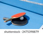 tennis rackets for playing ping pong on blue table, ping pong concept, active sports