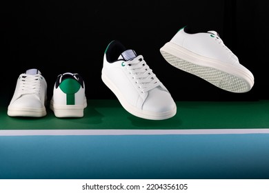 Tennis Shoes In Front, Back Sole And Top View In A Studio Shot