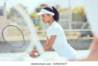 Tennis, sport and exercise with a sports woman playing a game or match on a court outside. Fitness, training and workout with a young female athlete ready for health and recreation with focus - Powered by Shutterstock