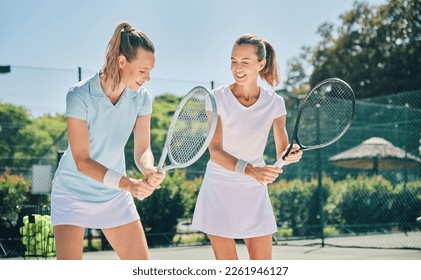 Tennis, sport and women with athlete and coach on outdoor turf, training instructor with fitness motivation and help. Exercise, sports lesson and workout together, teaching and learn skill on court - Powered by Shutterstock