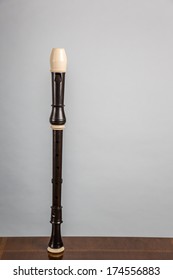 A Tenor Recorder On Wood With A White Background