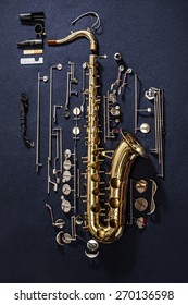 Tenor Saxophone, Exploded View Drawing Isolated On Blue Background.
Exploded Diagram Of Tenor Saxophone. Key Action Of Instrument.