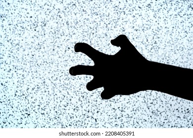 Tense Weirdly Twisted Fingers, Hand Black Silhouette Isolated On TV Screen, Noise, Closeup. Fear, Anger, Insanity, Rage, Mental Health Issues Abstract Concept. Creepy Scary Scene Detail, One Person