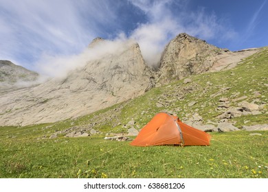 Tent beside a cliff wall in Buneset, Moskenesoeya, Lofoten, Norway - Shutterstock ID 638681206