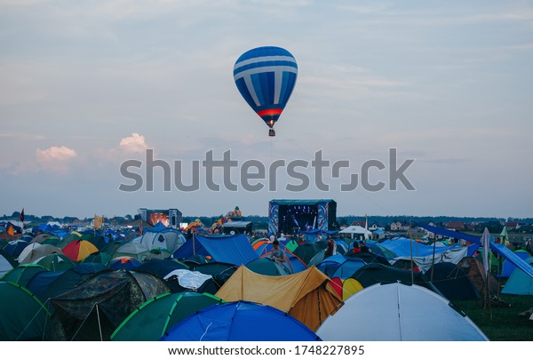 Tent camp at the festival. Many\
tents at a festival campsite. Tents at a music festival\
campsite.
