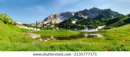 Similar – Image, Stock Photo Mountain lake shore with reeds and water reflection