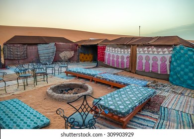 Tent camp for tourists in sand dunes of Erg Chebbi at dawn, Morocco