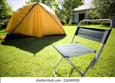 Tent And Camping Chair In Backyard