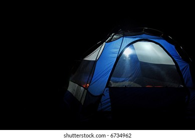 Tent In the Dark with Lantern Lit Inside