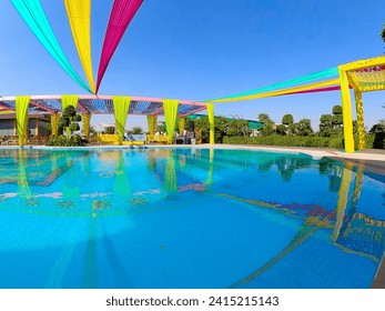 Tent decoration with cloth at a wedding ceremony with swimming pool and beautiful colorful cloth