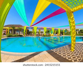 Tent decoration with cloth at a wedding ceremony with swimming pool and beautiful colorful cloth