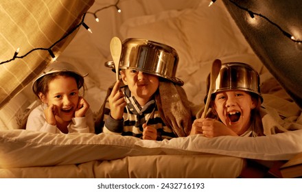 Tent, games and portrait of children at night in bedroom for playing and bonding together. Home, youth and happy kids with spoon, helmet pots and blanket fort for playful, imaginary and childhood fun - Powered by Shutterstock