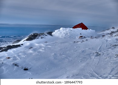 A Tent On The Edge Of A Mountain. Snow On The City Mountains In Bergen, Norway In January