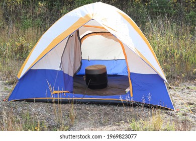 A Tent With A Portable Chemical Toilet Inside It