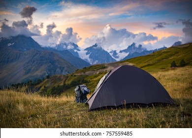 The tent stands on the background of high mountains. Around the wonderful landscape. Evening. Sunset. Tourism in the Caucasian Mountains in Georgia. - Shutterstock ID 757559485