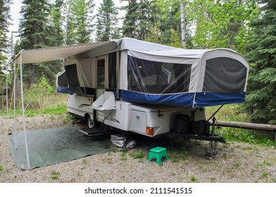 Tent Trailer Set Up In Wooded Campground