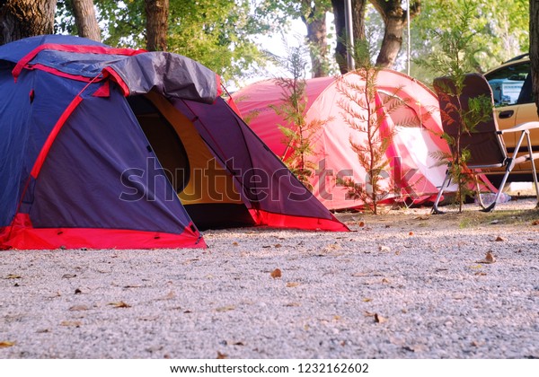 tent for travel is on the\
ground where tourists sleep, the theme of travel and outdoor\
activities\
